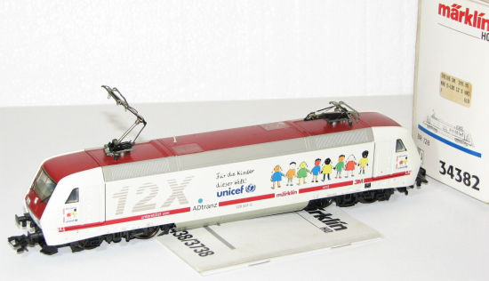 Märklin H0 34382 E-Lok BR 128 001-5 12X Unicef "Delta / Digital" #