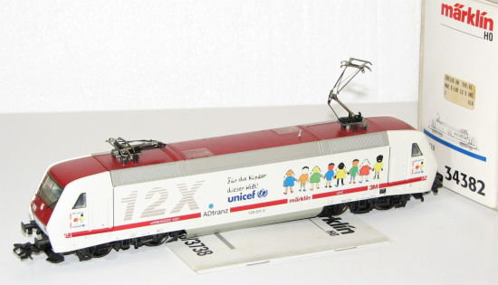 Märklin H0 34382 E-Lok BR 128 001-5 12X Unicef "Delta / Digital" #
